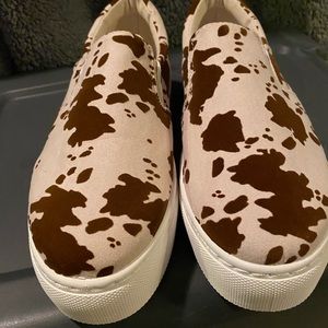Brand new slip on cow print shoes